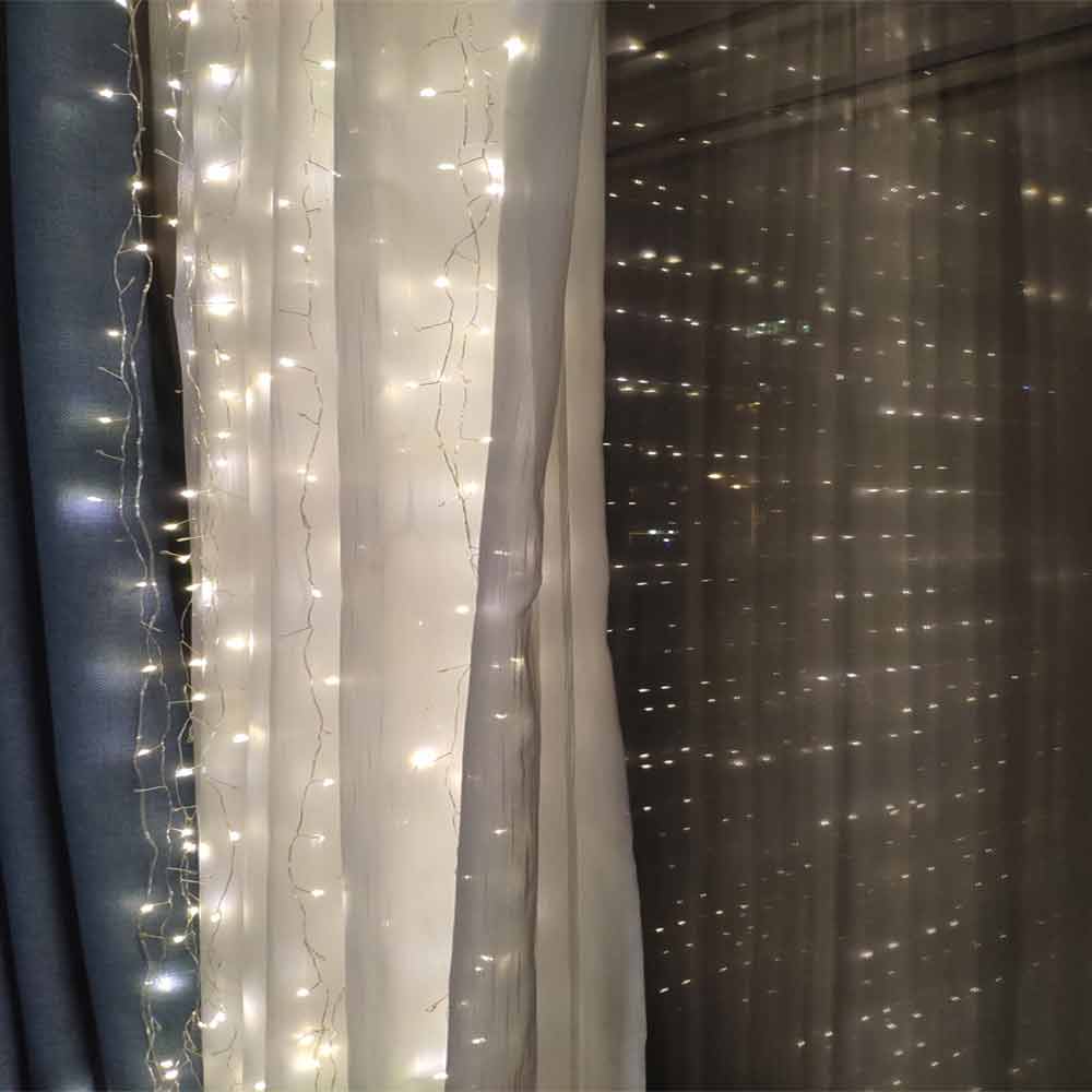 LED net lights draped over a hedge